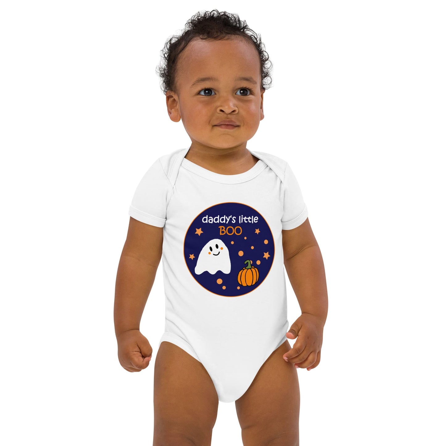 Black baby boy standing while wearing an organic cotton white bodysuit with Halloween ghost design, saying 'daddy's little Boo'.