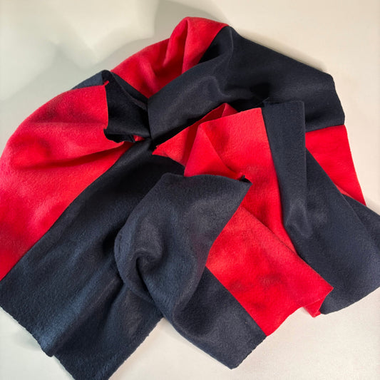 Red and navy blue scarf on a light background