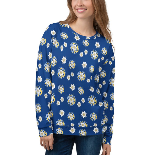 Woman wearing a blue sweatshirt with white and yellow floral Edelweiss patterns on a white background