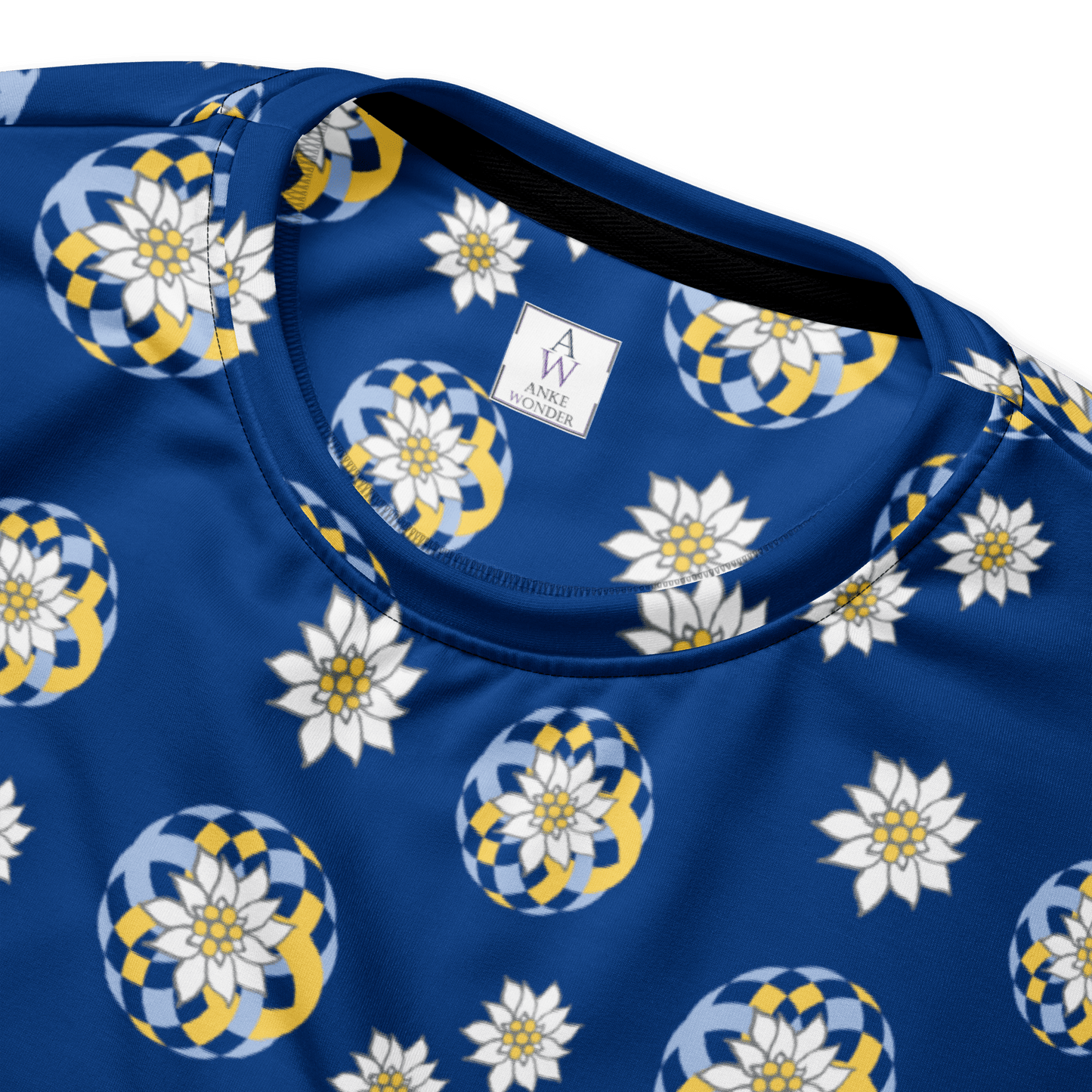 Close-up of blue sweatshirt neckline with floral pattern of Edelweß and the Anke Wonder brand label.