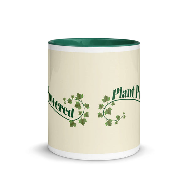 Front view of ceramic mug with 'Plant Powered' text and ivy design, featuring green accents on the handle and interior, ideal for eco-conscious lifestyles.