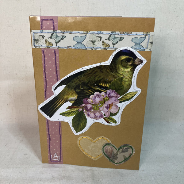 Front of Hand-Embroidered greeting card with vintage bird, purple flowers and heart applications for gifting