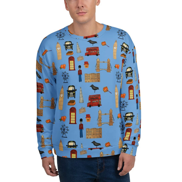 Close-up of a male model wearing a blue London-themed sweatshirt with an all-over print of Big Ben, Tower Bridge, red buses, black cabs, orange marmelade and royal guards.