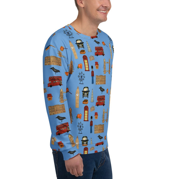 Close-up of the sweatshirt’s front right side, showing detailed prints of a black cab, Ferris wheel, red bus, and royal guard. The blue background contrasts with the iconic British symbols, creating a bold and stylish look.