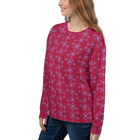 Close-up of the right side of the Festive Snowflake Women's Sweatshirt, showcasing the vibrant red fabric with light blue snowflakes arranged in vertical rows.