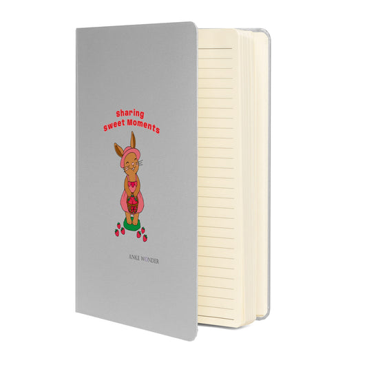 Notebook with a rabbit illustration and text on a white background