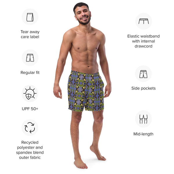 Man wearing tropical bird swim trunks with a handpainted blue design by Anke Wonder.
