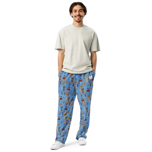 Front view of man wearing bold blue joggers with artistic handpainted London design.