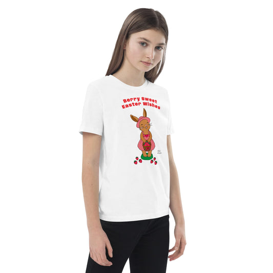 Girl wearing a white t-shirt with a Easter bunny design and text.