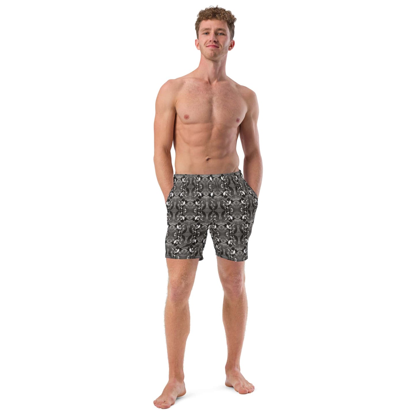 Men’s recycled swim trunks with a black and white bird print shown from the front. Features mid-length cut, elastic waistband, and eco-friendly design.