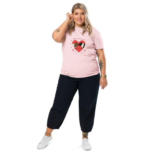 A plus-size woman with blonde hair wearing a pink organic cotton Valentine's T-shirt with a cute guinea pig heart print, designed by Anke Wonder.