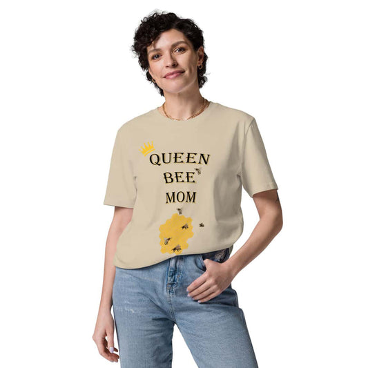 Woman wearing desert dust Queen Bee Mom t-shirt tucked into jeans, front view, casual and stylish look.