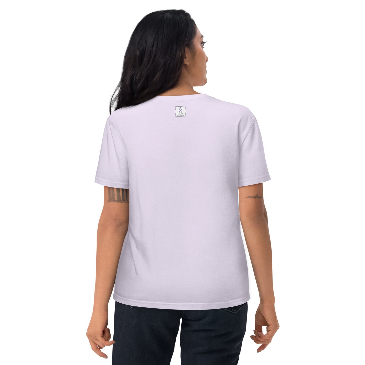 Back view of a woman in a lavender t-shirt, showcasing minimalist Anke Wonder branding near the collar. The shirt fits comfortably and flows naturally over jeans.