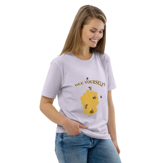 Woman wearing a white t-shirt with a graphic design of a beecomb and text 'Bee Yourself'on a white background