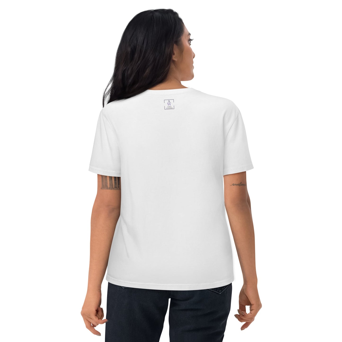 Woman showing the backside of the white organic cotton t-shirt, highlighting the neck label and fit.