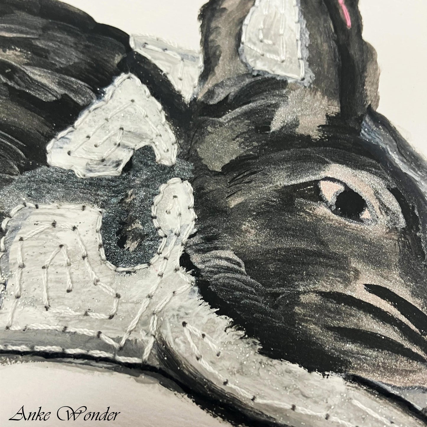Close-up view of the rabbit’s head in the "Rabbit in Meadow" artwork by Anke Wonder. The rabbit’s fur is painted in black and white acrylic, with delicate brushstrokes capturing a calm expression, bringing attention to the texture and detail in the fur.