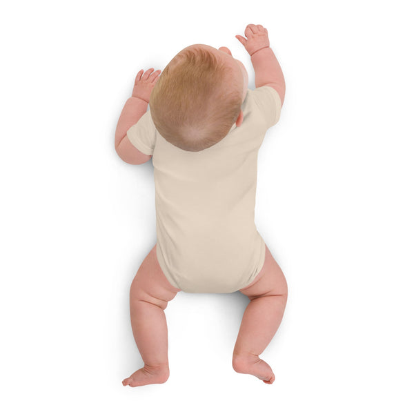 Backside of the organic cotton baby bodysuit in natural color, showing the soft fabric and high-quality stitching. Designed by Anke Wonder.