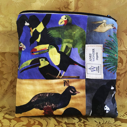 Fabric pouch with bird collage design on a gold patterned background