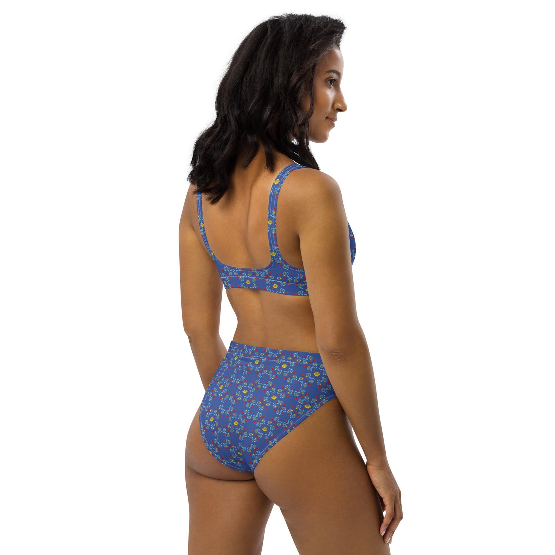 A right-angled back view of a woman in a chlorine-resistant, high-waisted bikini with a striking blue rose design, emphasizing comfort and support.