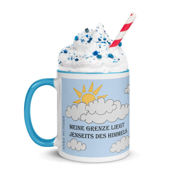 Left side view of blue ceramic mug showing Anke Wonder logo and the German quote 'Meine Grenze liegt jenseits des Himmels,' with blue handle and interior.