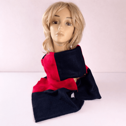 Mannequin wearing a navy and red scarf on a white background