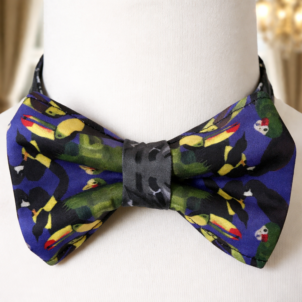 Colorful bow tie with bird pattern on a mannequin head.