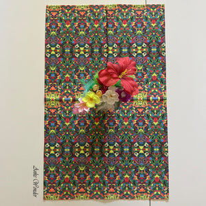 Organic cotton tablecloth with a vibrant floral print, butterflies, and ladybugs, elegantly displayed on a dining table.