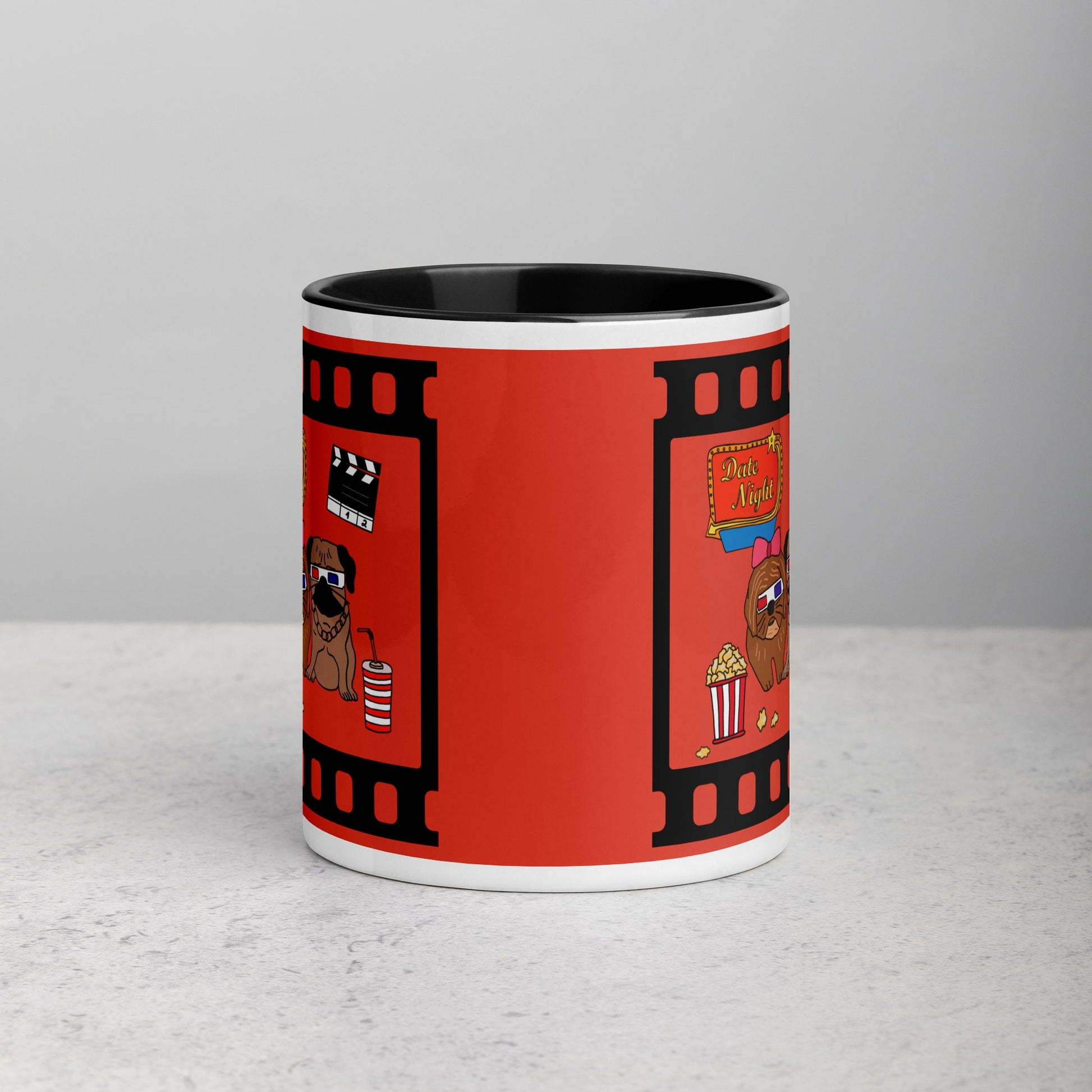 Front view of ceramic mug with black rim and handle, featuring pugs on a date night with popcorn and 3D glasses in a movie theater design.