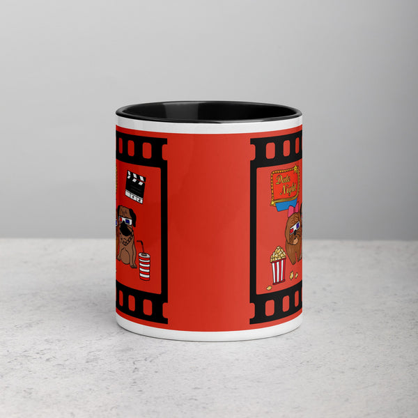 Front view of ceramic mug with black rim and handle, featuring pugs on a date night with popcorn and 3D glasses in a movie theater design.