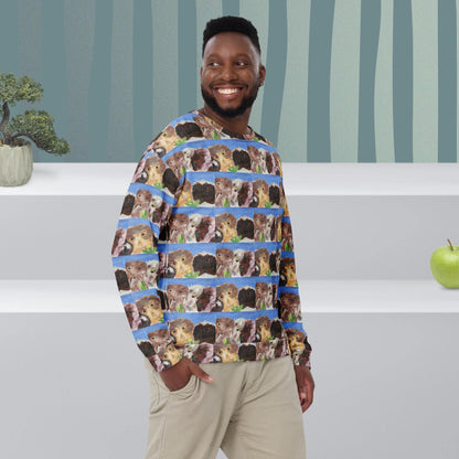 Man wearing a sweater with hand-painted guinea pig pattern in a room with striped wallpaper and a plant.