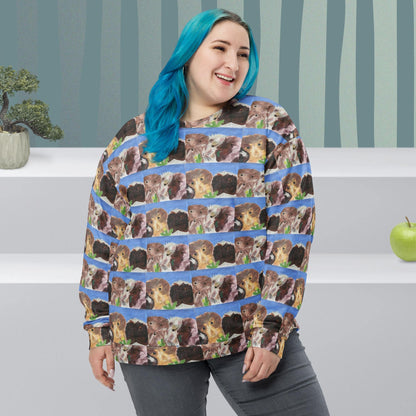 Woman wearing a sweater with guinea pig pattern in a room with striped wallpaper.