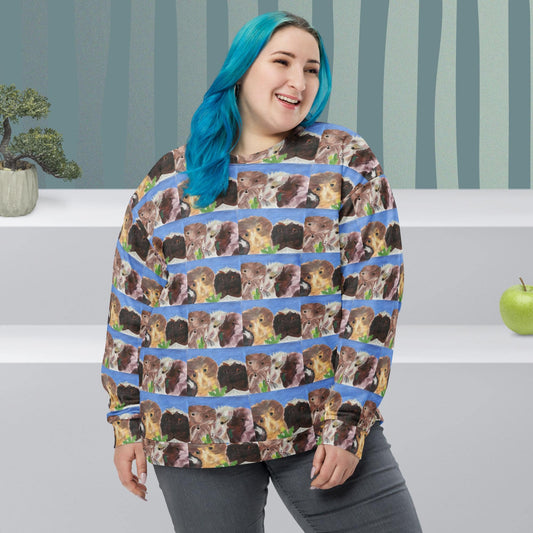 Woman wearing a sweater with guinea pig pattern in a room with striped wallpaper.