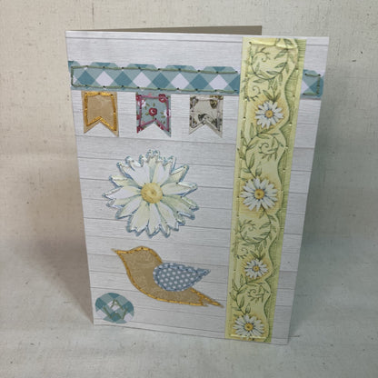 Front of Hand-Embroidered floral greeting card with a yellow and blue bird application for gifting.