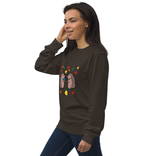 Side view of model wearing brown Hedgehog Hugs Organic Cotton Women Sweatshirt, showcasing the soft, organic cotton fabric and cozy fit.