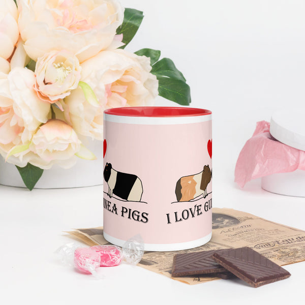 Front view of ceramic mug showing two guinea pigs facing each other with a heart above and the words "I Love Guinea Pigs" in bold letters.