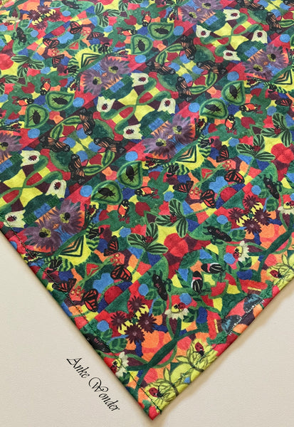 Organic cotton sateen tablecloth with a colorful floral kaleidoscope print.