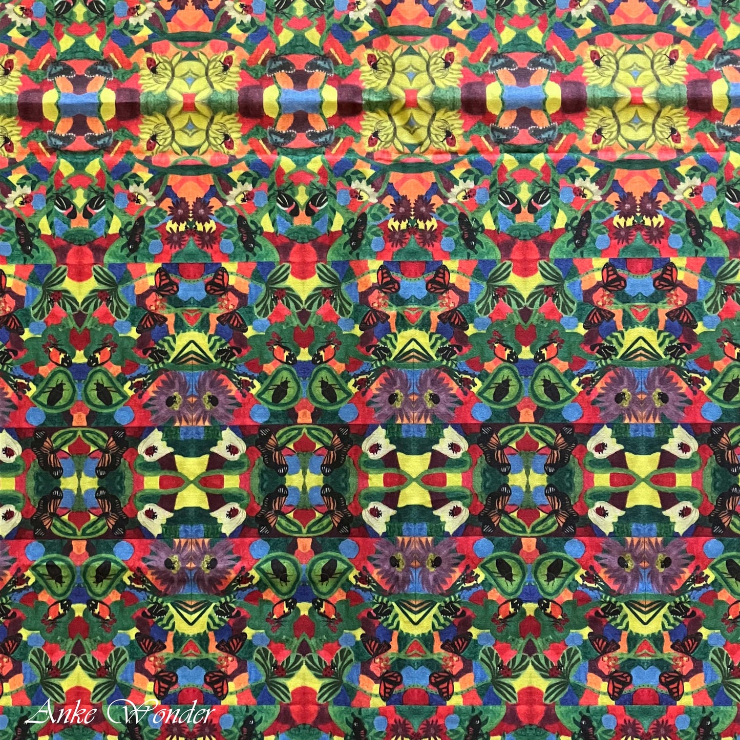 A detailed view of the colorful floral pattern with butterflies and ladybugs, digitally printed on organic cotton sateen fabric.