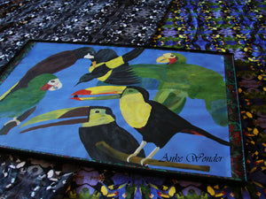 Picture shows a bird painting laying on fabric with same pattern.
