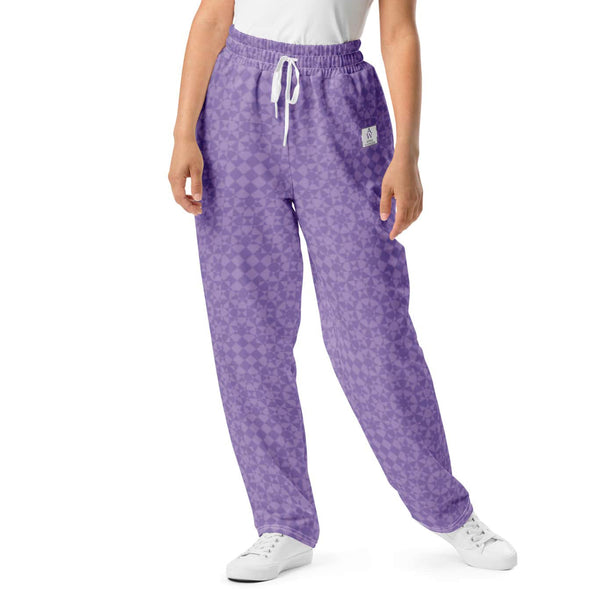 Purple lavender wide-leg joggers with a geometric pattern shown in a close-up front view.