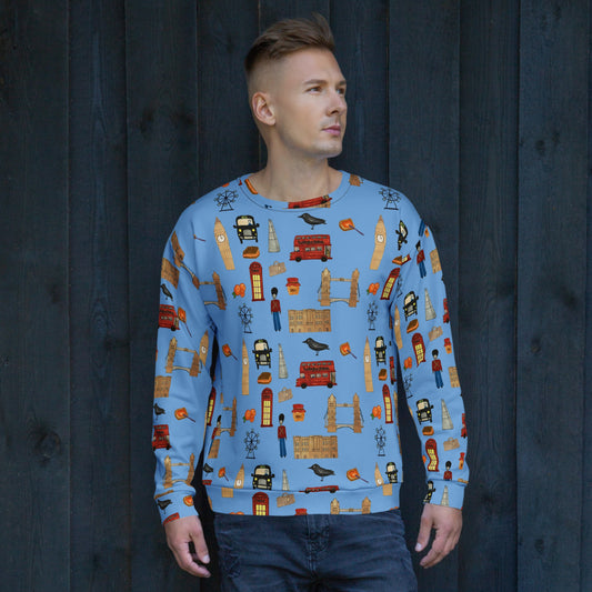 A male model wears a blue London-themed sweatshirt with an all-over print of Big Ben, Tower Bridge, red buses, black cabs, and royal guards. Made from 95% recycled polyester, this eco-friendly sweatshirt is stylish, soft, and comfortable.