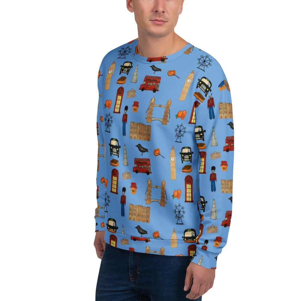 Close-up of the sweatshirt’s front left side, worn by a male model. The design features Big Ben, Tower Bridge, and a red phone booth on a rich blue background, highlighting the detailed London-inspired artwork.
