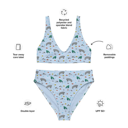 A flat lay of a high-waisted bikini with a manatee and turtle print, highlighting the soft, double-layered fabric, UPF 50+ protection, and quality stitching.
