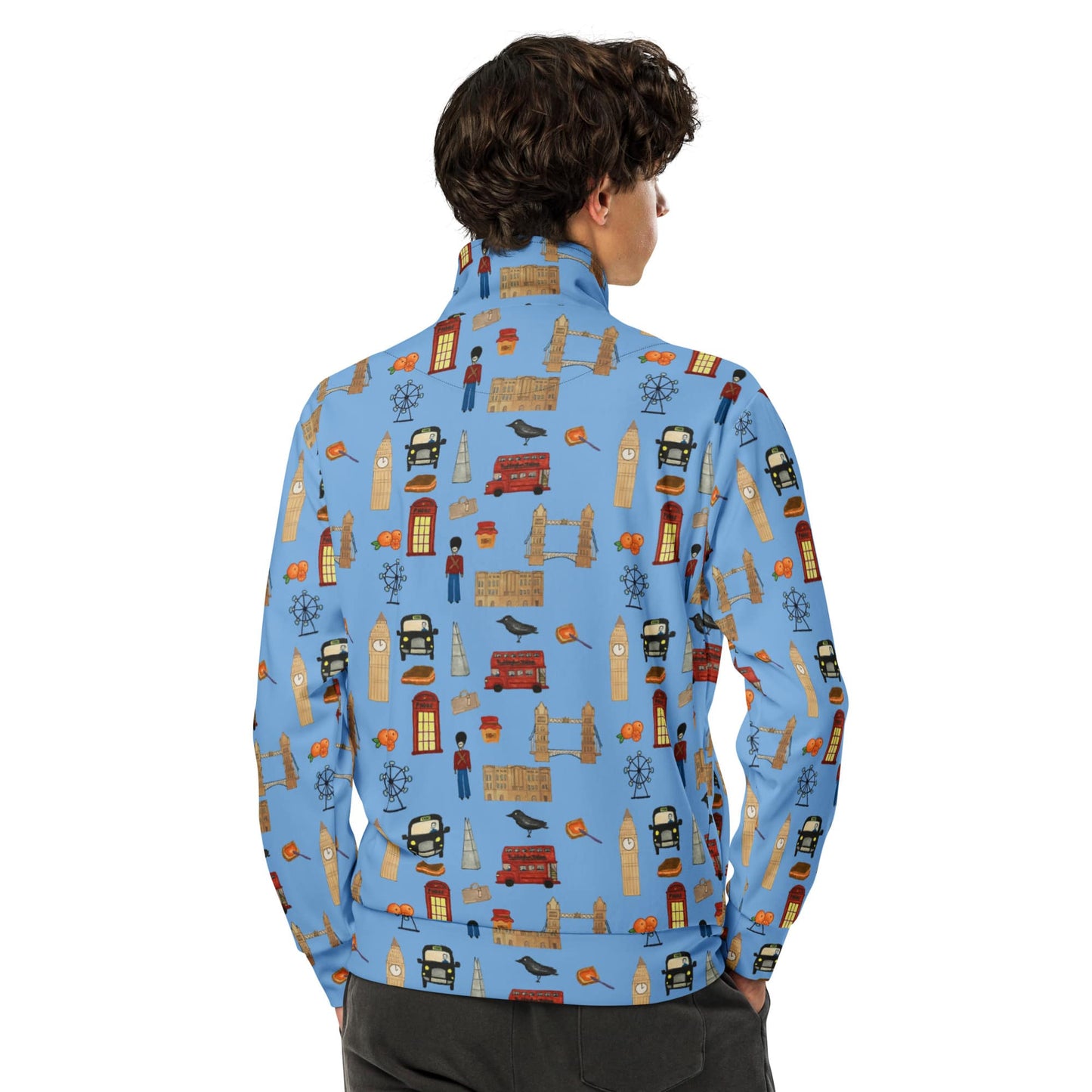 Back view of man wearing a blue recycled polyester track jacket, showcasing detailed London icons printed on the sleeves and shoulders, and the sleek athletic fit.