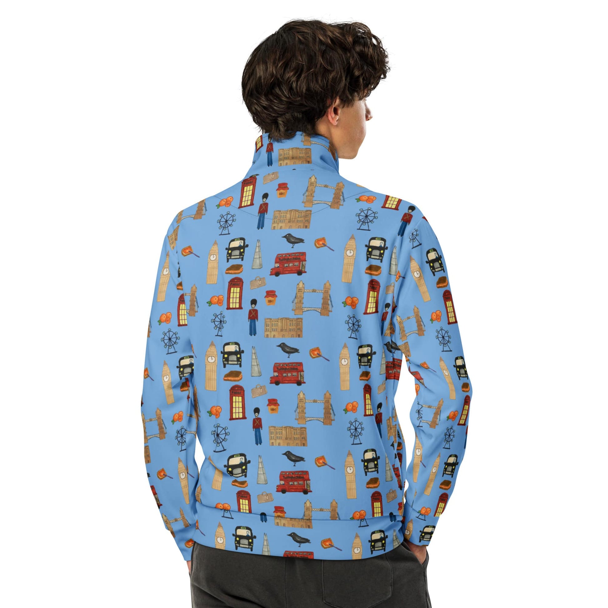 Back view of man wearing a blue recycled polyester track jacket, showcasing detailed London icons printed on the sleeves and shoulders, and the sleek athletic fit.