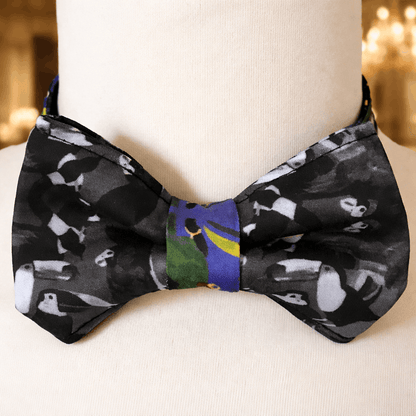 Black bow tie with bird pattern on a mannequin