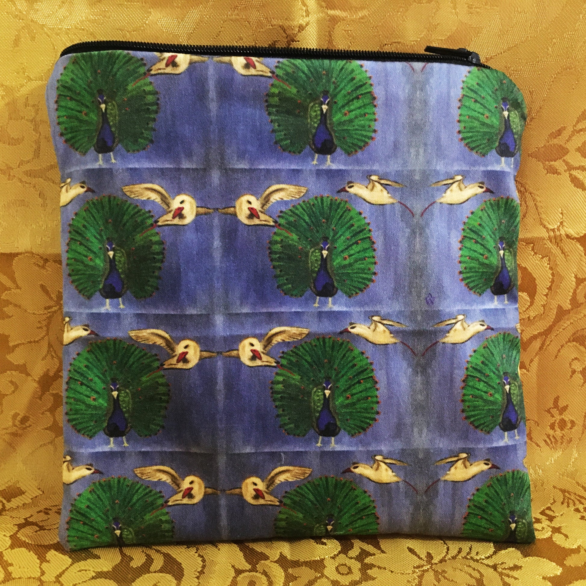 Pouch with peacock and bird pattern on a gold background