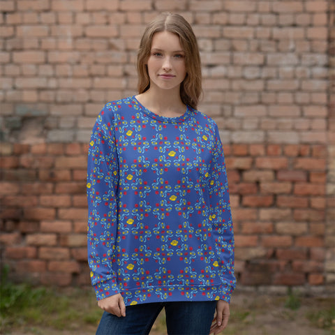 A model wearing Anke Wonder's blue floral sweatshirt outdoors in a casual lifestyle setting.