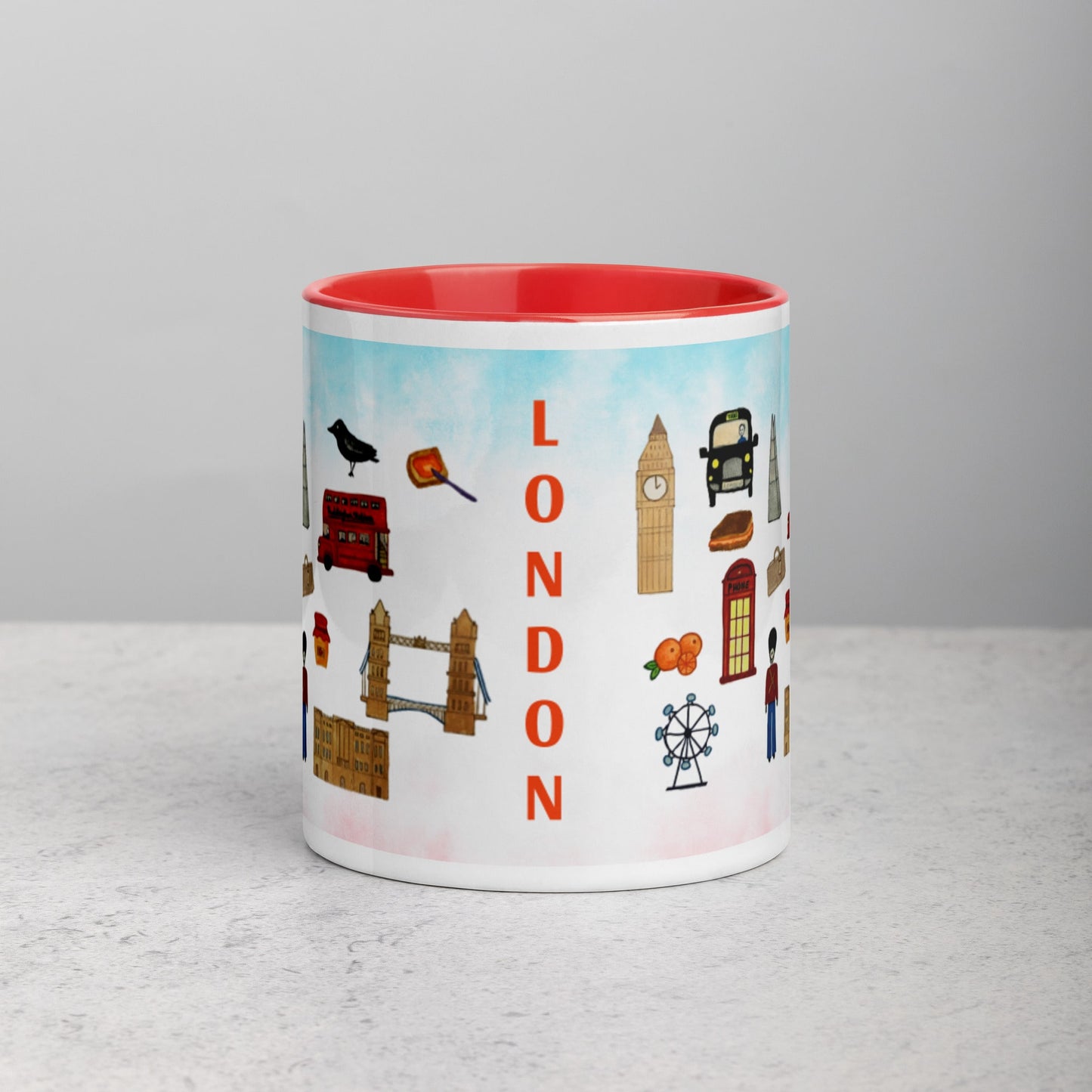 Ceramic mug with red interior featuring London icons and landmarks design, bold LONDON text in the center.