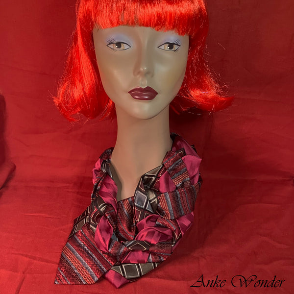 Red and silver women's necktie with a weaving design, displayed on a mannequin, made from upcycled men's ties for a chic and eco-friendly look.