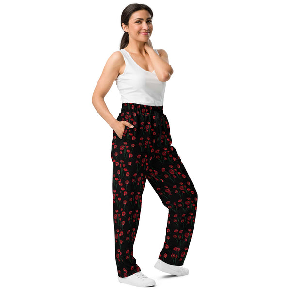 Side view of women's wide-leg joggers showing the floral poppy print and side pockets, highlighting the comfortable, relaxed fit.